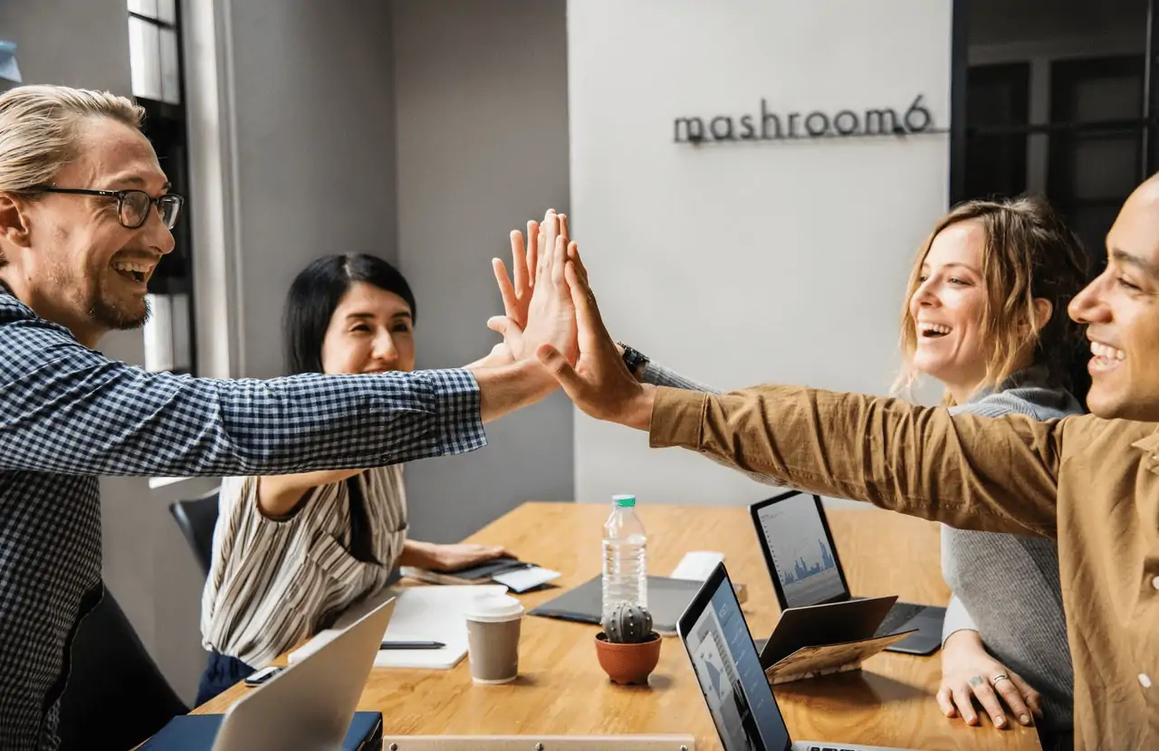 Photo of a manager happily offloading tasks to their team. 