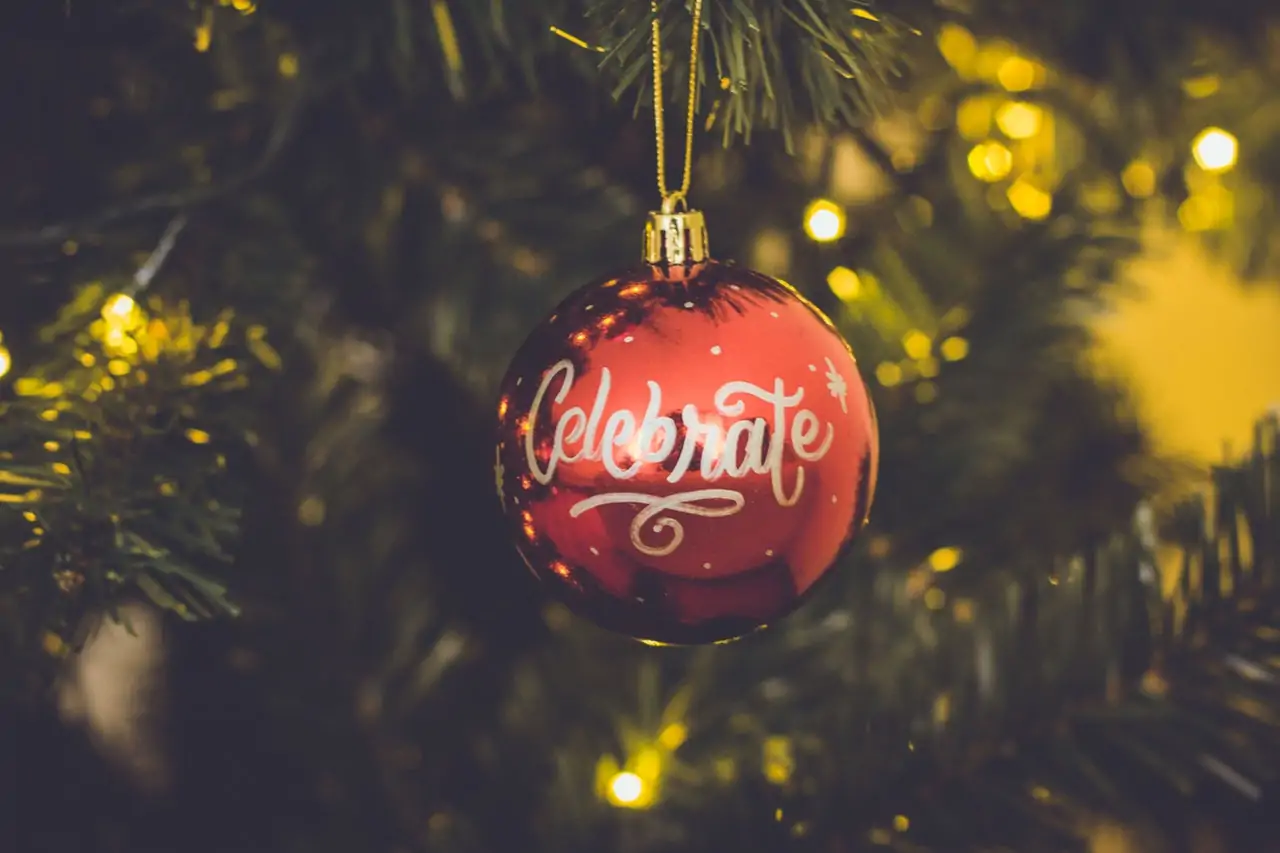 Photo of a holiday ornament that says "Celebrate."
